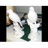 A pair of 15cm high ceramic bird ornaments