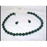 A malachite necklace with 9ct gold clasp, together