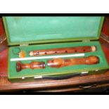 An Ariel three piece wooden recorder in carrying ca