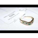 An emerald and diamond ring in 14ct gold setting