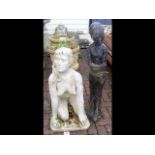 A kneeling female nude garden ornament, together w
