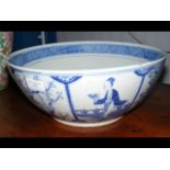 An antique oriental bowl decorated with ladies and