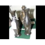 A pair of pewter oriental vases - with signature t