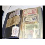 An album containing various collectable banknotes