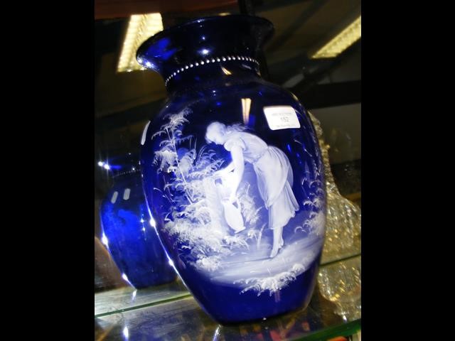 A 29cm Mary Gregory blue glass vase