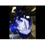 A 29cm Mary Gregory blue glass vase