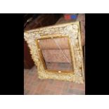 A decorative gilt picture frame - 100cm x 88cm
