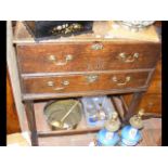 A Georgian oak two drawer chest with 'E I R' inscr