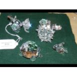 Seven boxed Swarovski ornaments, including a Squir