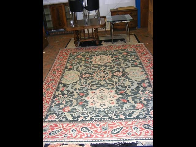 A large Middle Eastern style carpet with geometric