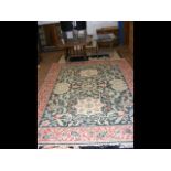 A large Middle Eastern style carpet with geometric