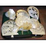 A tray of old carved oyster shells - various scene