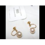 A pair of cultured pearl screw-on earrings in 9ct