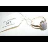 A lady's opal ring in 18ct gold setting