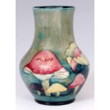 AN EARLY 20th CENTURY WILLIAM MOORCROFT CLAREMONT VASE with toadstool design, green signature and