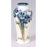 AN EARLY 20th CENTURY MINIATURE WILLIAM MOORCROFT MACINTYRE FLORIAN WARE VASE blue poppy pattern