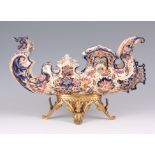 J. FISCHER BUDAPEST, A 19TH CENTURY HUNGARIAN POTTERY ORMOLU MOUNTED CENTRE PIECE of brightly