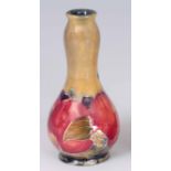 AN EARLY 20th CENTURY MINIATURE WILLIAM MOORCROFT POMEGRANATE VASE signed WM and impressed marks