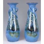 A PAIR OF ART NOVEAU STYLE POTTERY VASES BY LEMON AND CRUTE, TORQUAY with twisted handles and