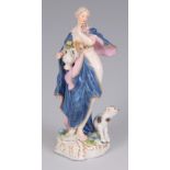 AN EARLY MEISSEN FIGURE GROUP depicting a nude lady next to a seated cat 14cm high.