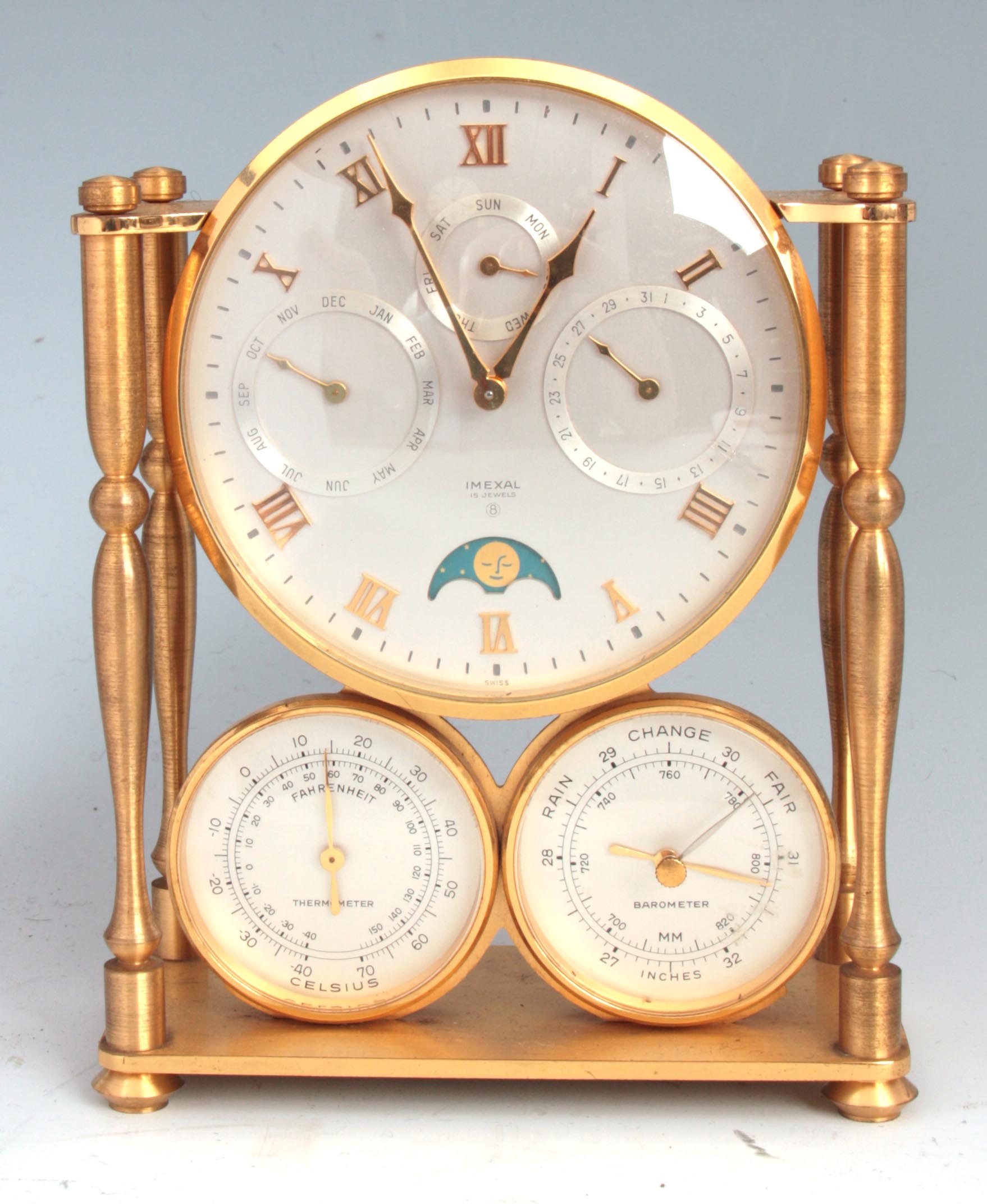 A 20TH CENTURY IMEXAL CALENDAR/ BAROMETER MANTEL CLOCK with brass case having turned pillar