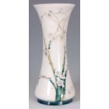 A LARGE EARLY 20th CENTURY MOORCROFT MACINTYRE PRUNUS DESIGN VASE MADE FOR LIBERTY & CO. green