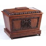 A WILLIAM IV POLLARD OAK SARCOPHAGUS SHAPED WINE COOLER the hinged lid with leaf carved gadrooned