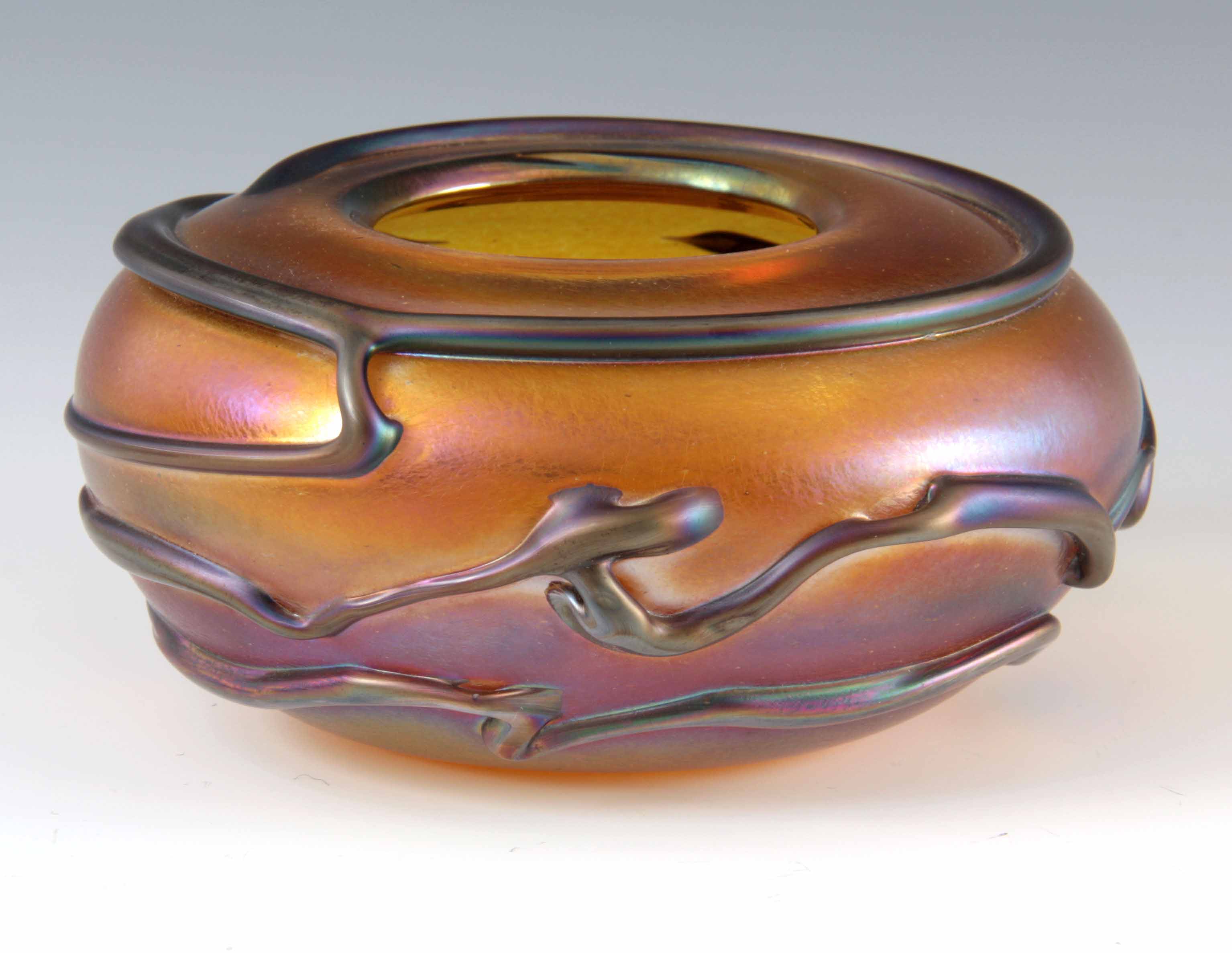 A LATE 20TH CENTURY JOHN DITCHFIELD GLASS FORM IRIDESCENT GLASS BOWL, signed and numbered, with