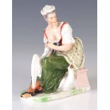 A 19TH CENTURY MEISSEN PORCELAIN FIGURE GROUP of a seated young lady feeding geese 14cm high.