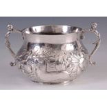 A RARE CHARLES II SILVER PORRINGER with bombe body heavily chased with a running stag and lion