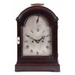 JESSOP, LONDON. A GEORGE III EBONISED BRACKET CLOCK the moulded arched top above a glazed hinged