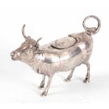 A DUTCH SILVER COW CREAMER with a bee embossed on the hinged lid bearing continental hallmarks