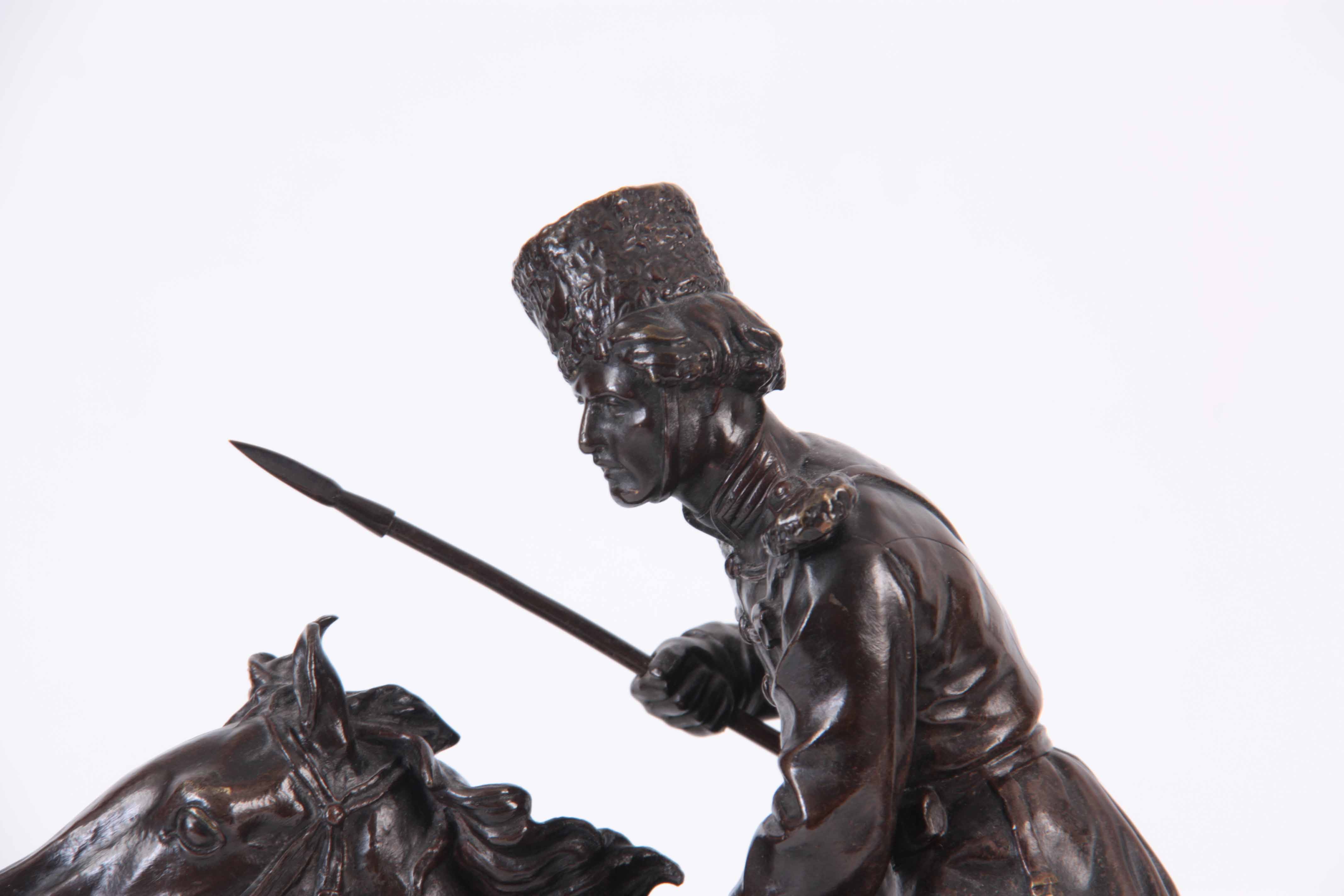 E. NAHCEPE. A LATE 19TH CENTURY RUSSIAN PATINATED BRONZE SCULPTURE modelled as a Cossack on charging - Image 2 of 8