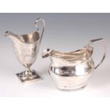 TWO GEORGE III SILVER CREAM JUGS the first of helmet shape with beaded border and floral engraved