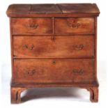 AN EARLY 18TH CENTURY PROVINCIAL GEOMETRIC INLAID WALNUT CHEST OF DRAWERS with front to back plank