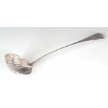 A GEORGE III SILVER SOUP LADLE with shell style bowl and finely engraved handle 32cm long, app. 5.