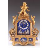 A LATE 19TH CENTURY FRENCH ORMOLU AND PORCELAIN PANEL MANTEL CLOCK having an arched case