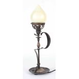 AN EARLY 20TH CENTURY ARTS AND CRAFTS BRASS TABLE LAMP in the form of a chamber stick with