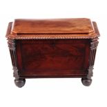 A LATE REGENCY FLAMED MAHOGANY CELLARETTE / WINE COOLER IN THE MANNER OF GILLOWS with a moulded