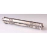 A MID 20th CENTURY SRI LANKAN SILVER SCROLL CASE having foliate scrollwork repousse with stylised