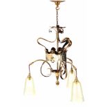 AN EARLY 20TH CENTURY ARTS AND CRAFTS/ART NOUVEAU THREE BRANCH LIGHT FITTING of whiplash design with