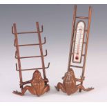 A PAIR OF LATE 19TH CENTURY NOVELTY BRONZE FROG DESK STANDS formed as a seated frog with copper