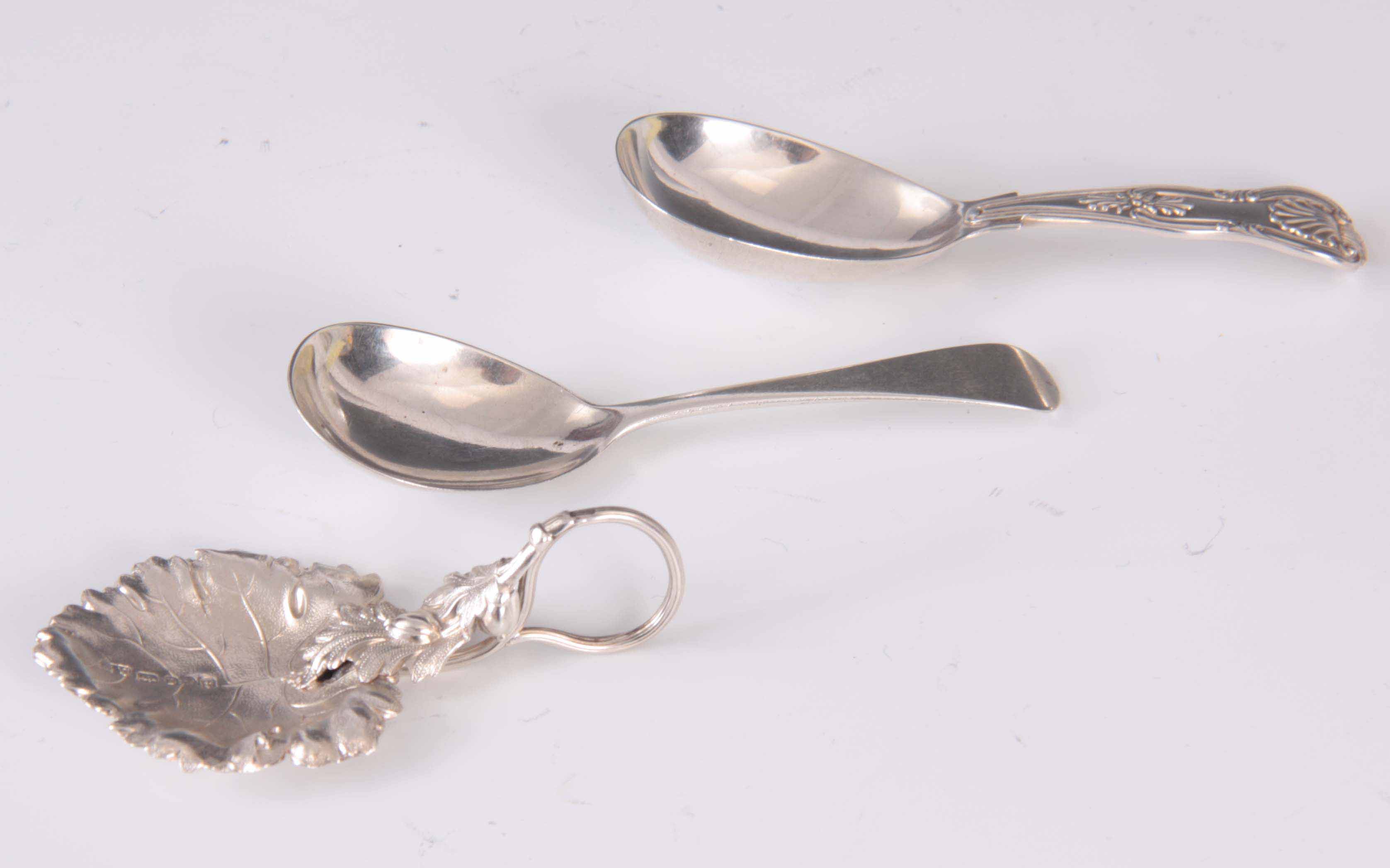 A COLLECTION OF THREE SILVER CADDY SPOONS app. 1.7 troy oz