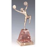 AN ART DECO SILVERED BRONZE FIGURE OF A DANCING GIRL HOLDING CIRCULAR FANS mounted on a tapered