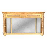 A REGENCY GILT GESSO OVERMANTEL MIRROR with moulded cornice and domed sides above twisted columns