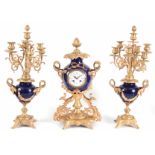 A LATE 19TH CENTURY FRENCH ORMOLU AND PORCELAIN CLOCK GARNITURE the blue porcelain case with