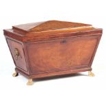 A REGENCY MAHOGANY SARCOPHAGUS SHAPED WINE COOLER / CELLARETTE with angled hinged top revealing a