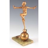 A 1930S ART DECO GOLD PATINATED FIGURE OF A DANCER IN THE MANNER OF LORENZL, incorporating an