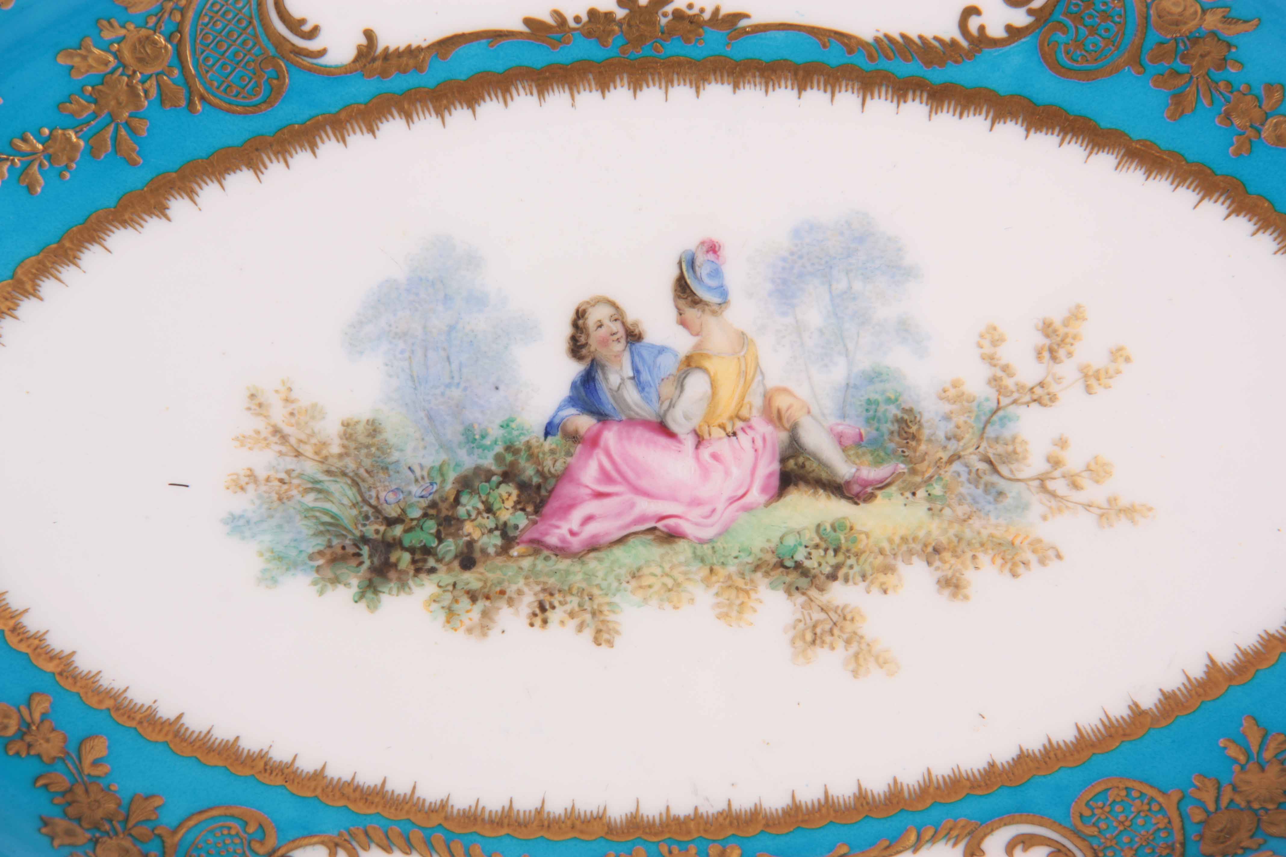 A FINE 18TH CENTURY SEVRES PORCELAIN SHALLOW OVAL DISH on a gilded celestial blue ground decorated - Image 2 of 5