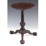 An 18TH CENTURY MAHOGANY CANDLE STAND OF SMALL SIZE the pie crust moulded top above a tapering